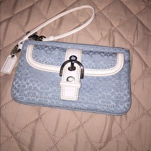 Baby blue Coach wristlet. Never used.