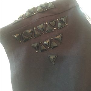 Black top with embellished shoulders and chains