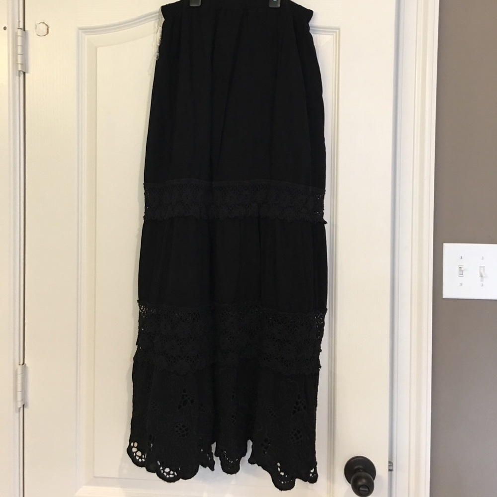 Black lace and embroidered maxi skirt .