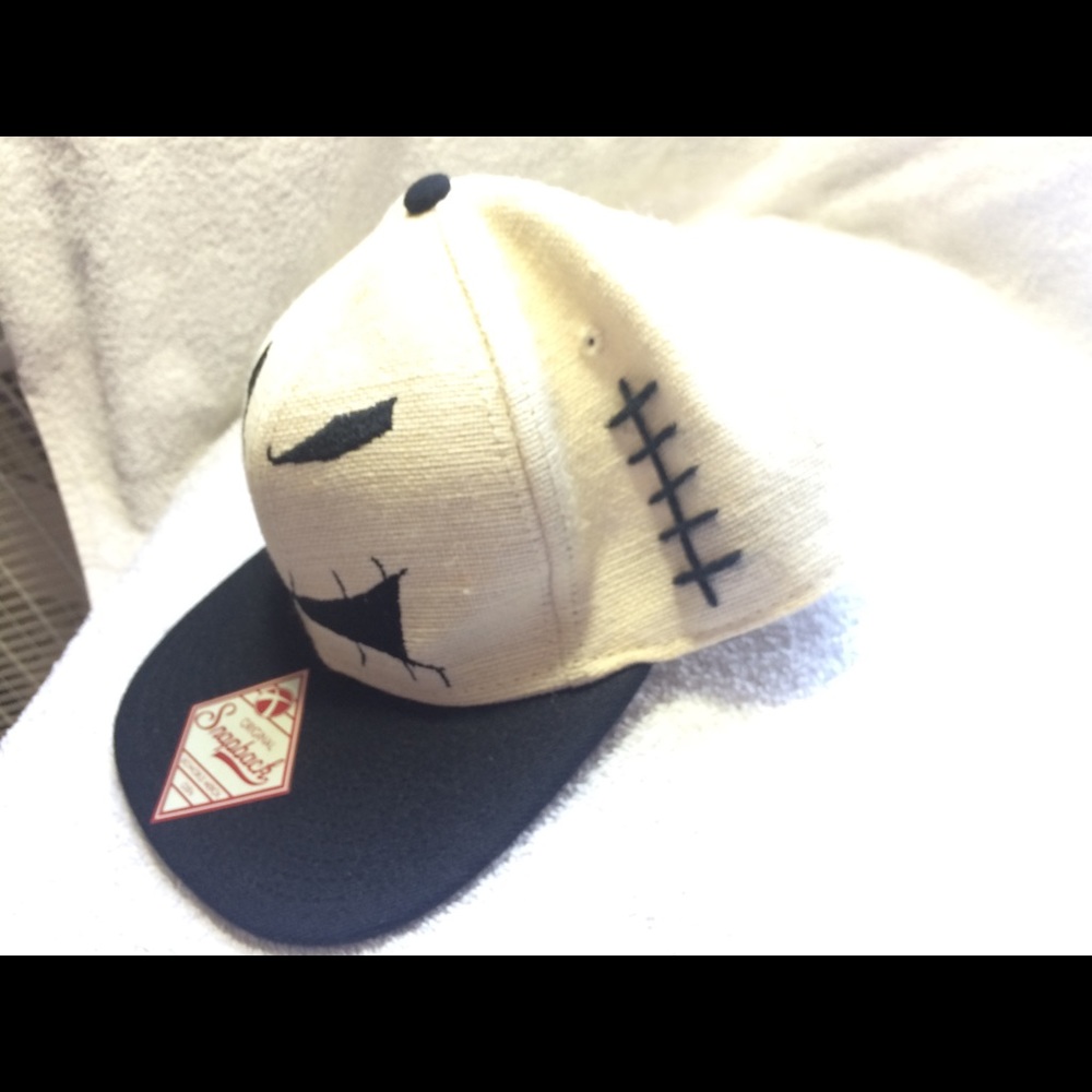 White hat with face and the original price of 27$