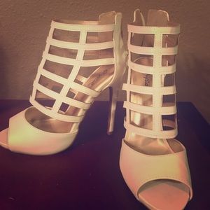 Brand new women's caged  heels size 8