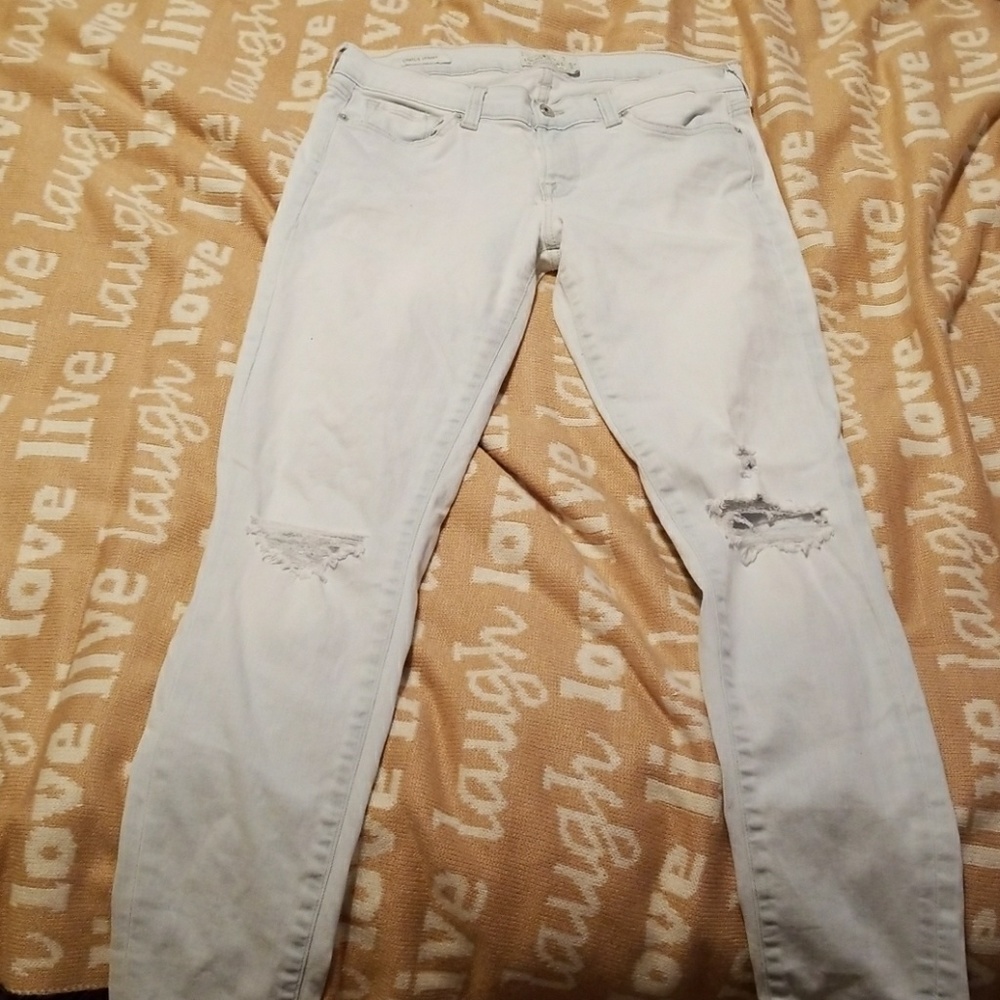 Lucky Brand distressed pale blue jeans