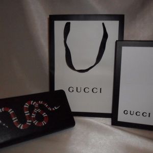 Kingsnake print leather zip around wallet $ 720 Kingsnake print leather zip around wallet $ 720