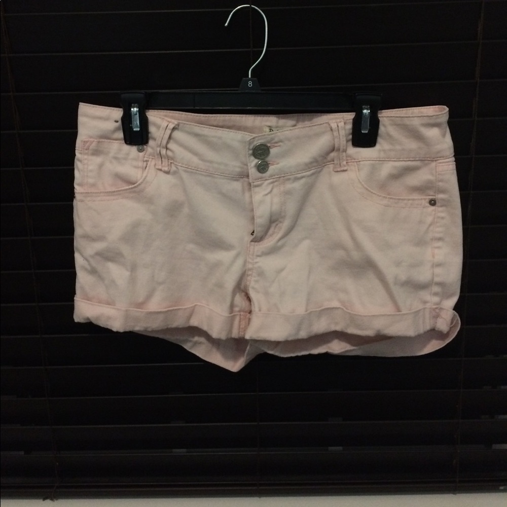Light pink shorts.