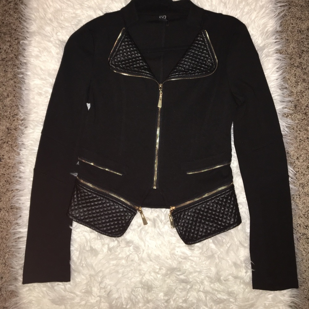 Black jacket with gold zippers