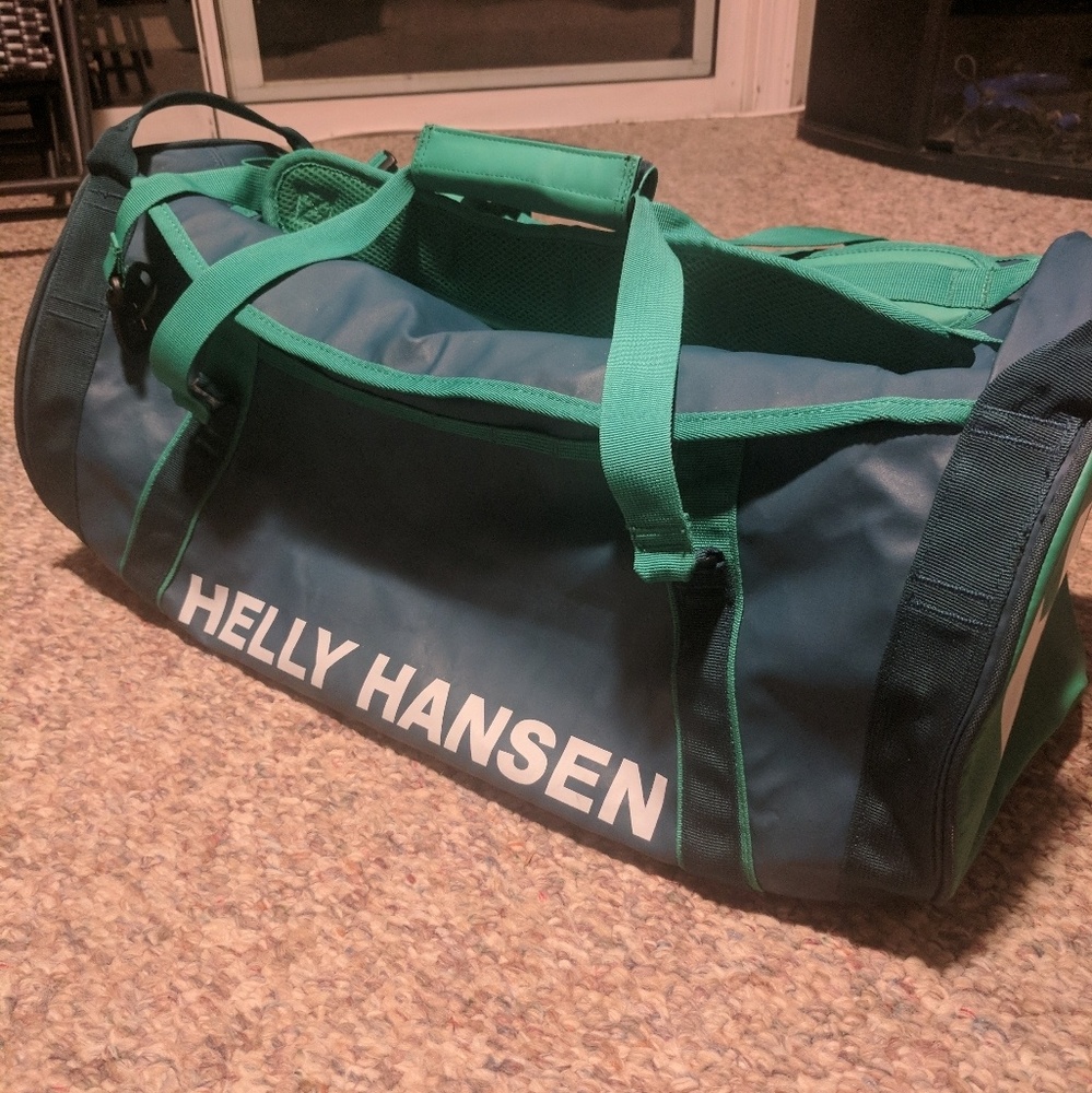 Like new Helly Hansen 50L duffle in navy/seafoam