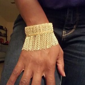 Gold tone cuff with chain fringe