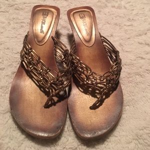 Gold sandal with wooden sole