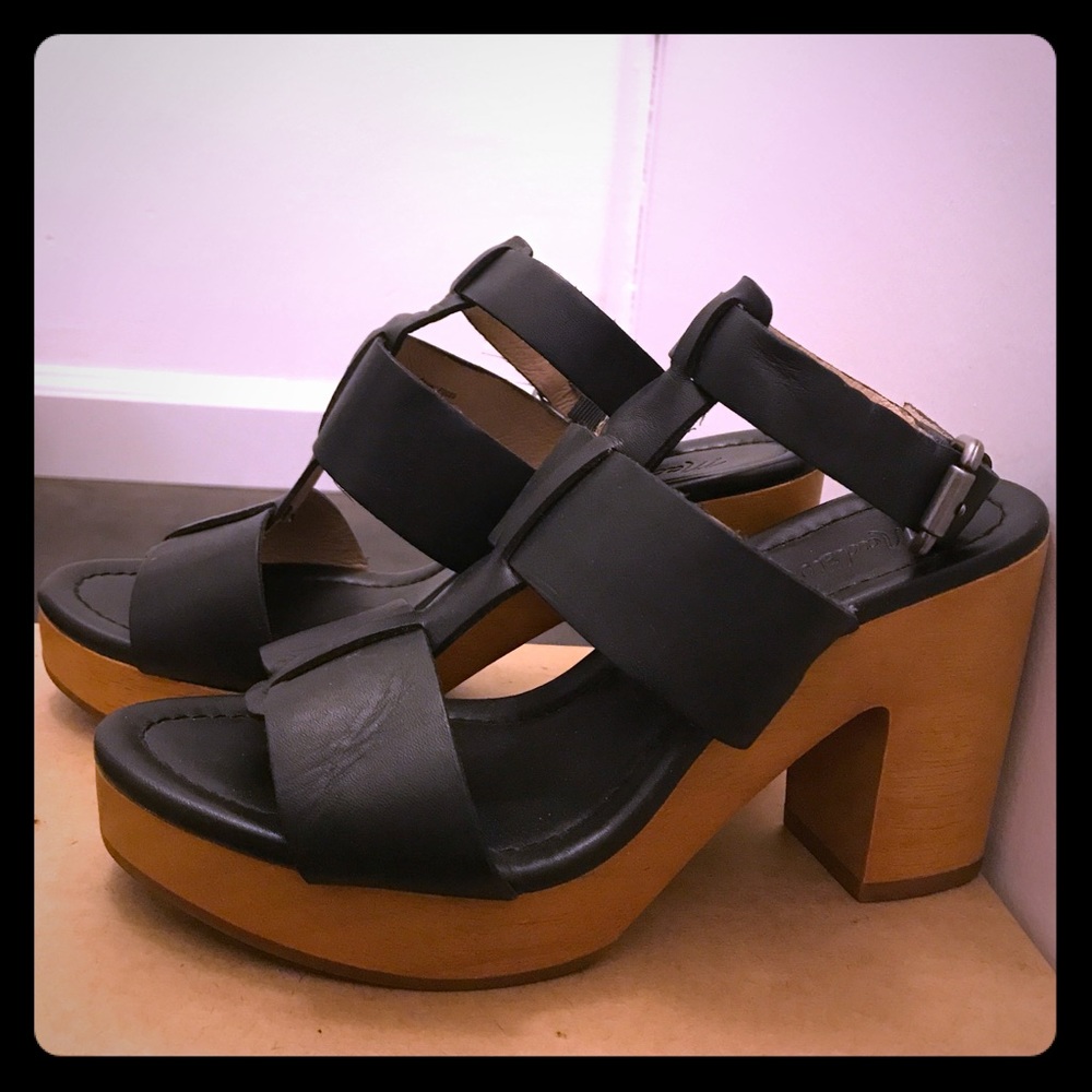 Chunky black leather strapped wooden platforms