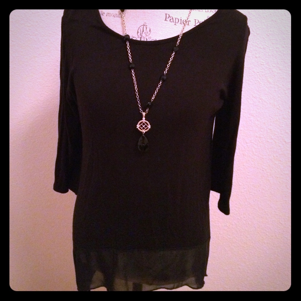 Beautiful Black Blouse with sheer bottom .