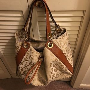 Authentic: Michel Kors Handbag.