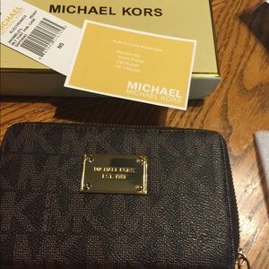 Brown monogram Michael Kors flat wallet/Wristlet