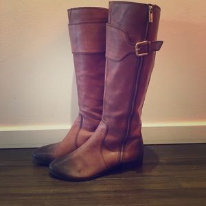 Knee high leather boots.