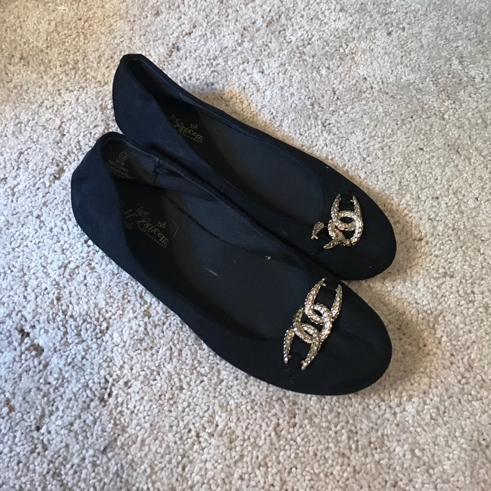 Black flats with gold hardware