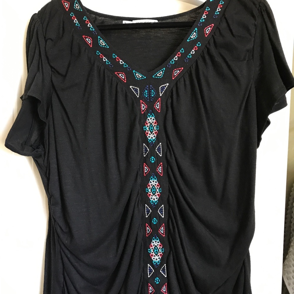 Maurice's embroidered top.