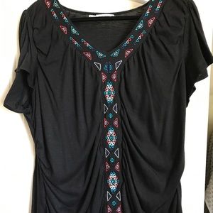 Maurice's embroidered top.