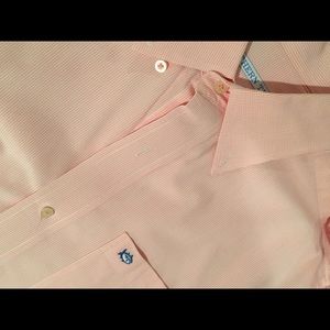A pink southern tide button down shirt.