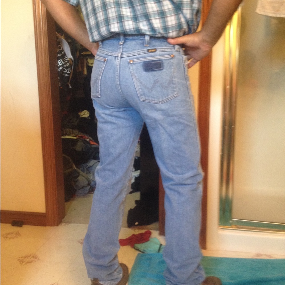 Distressed cowboy cut Wranglers