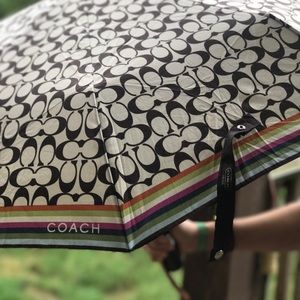 COACH umbrella! Comes with a matching coach cover.