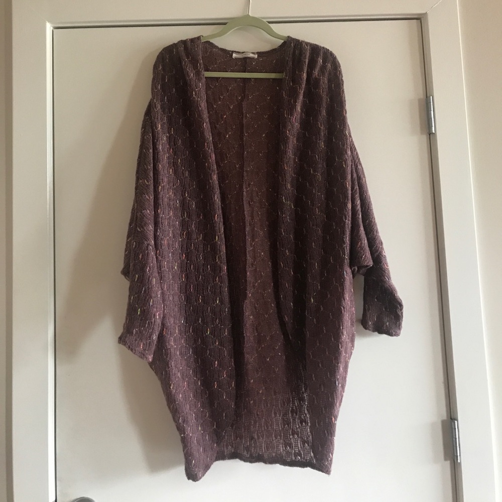 Purple long sleeved cardigan.
