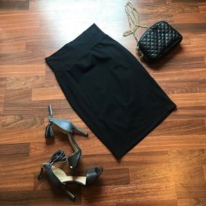 Black body-con pencil skirt with thick band. Black body-con pencil skirt with thick band.