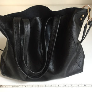 Black leather tote handbag with removable lining