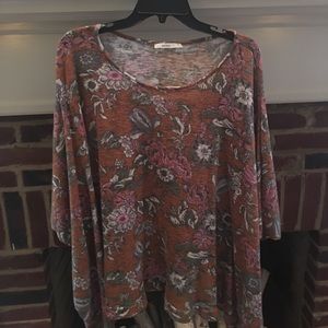 An orange floral print poncho