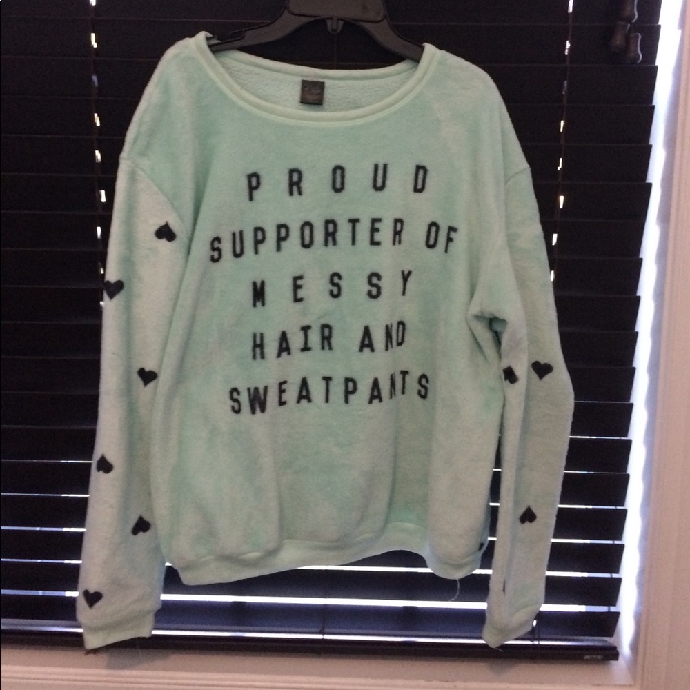 A mint green long sleeved night shirt