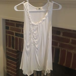 A white tank top with detail on the front