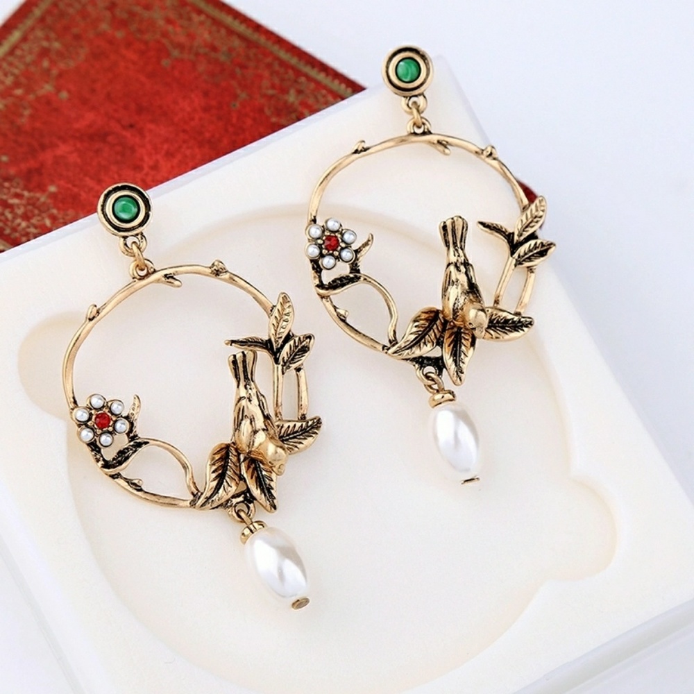 Gold and pearl bird earrings