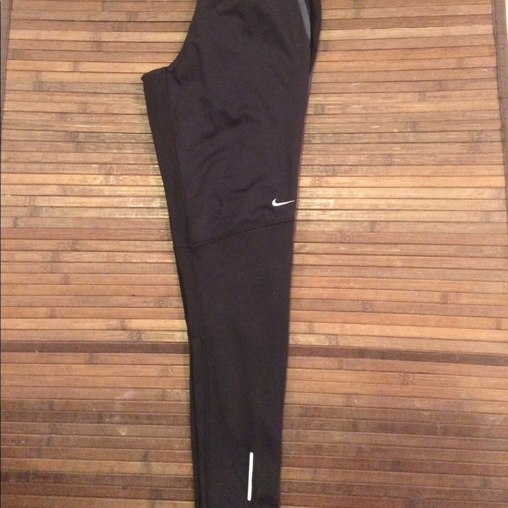 Nike Dri Fit running pants with zip on legs, small