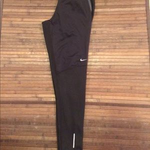Nike Dri Fit running pants with zip on legs, small