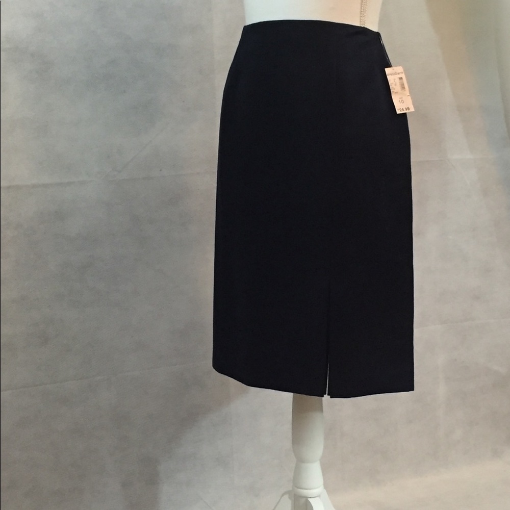 Black skirt with side kick pleat.