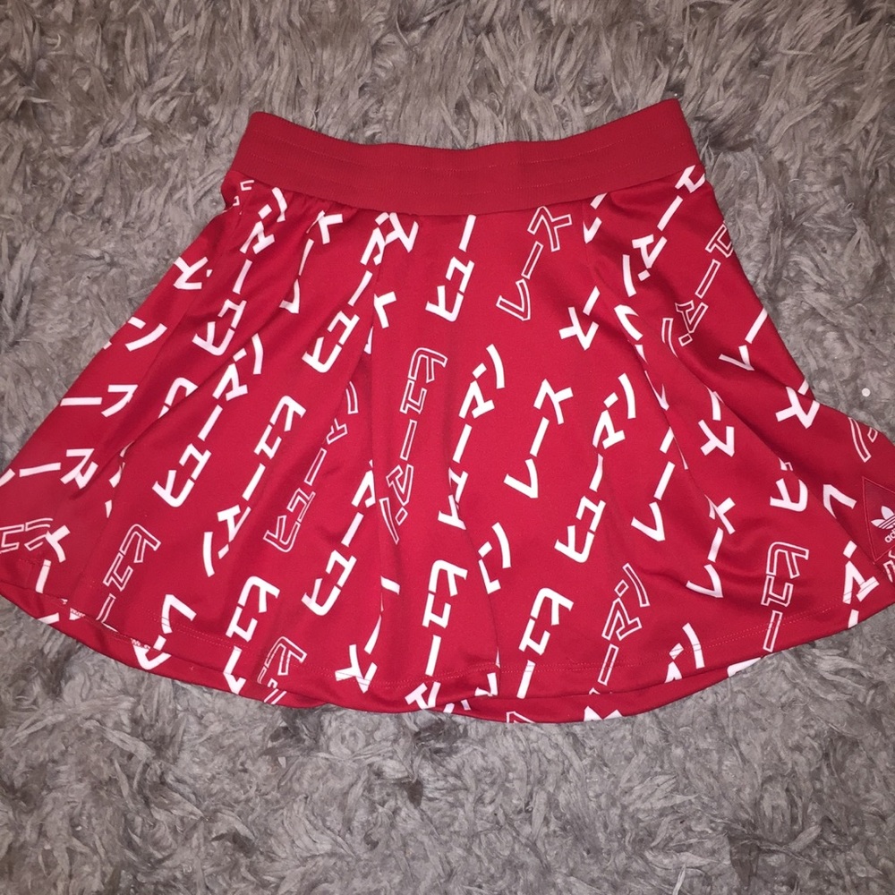 Red brand new adidas Pharrell Williams line skirt