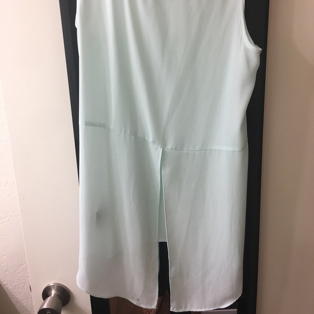 Light blue tank top with open lower back