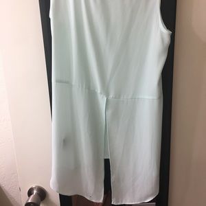 Light blue tank top with open lower back