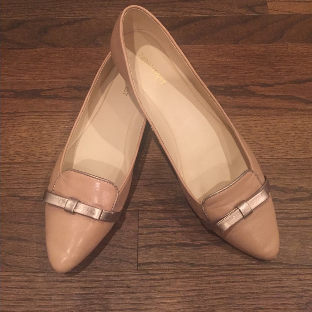 Nine West tan flats; size 9.5. Gold bow detail.