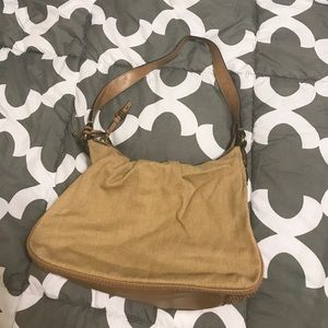 Tan fossil purse with floral print inside Tan fossil purse with floral print inside
