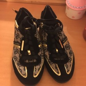 Black and gold Michael kors sneakers
