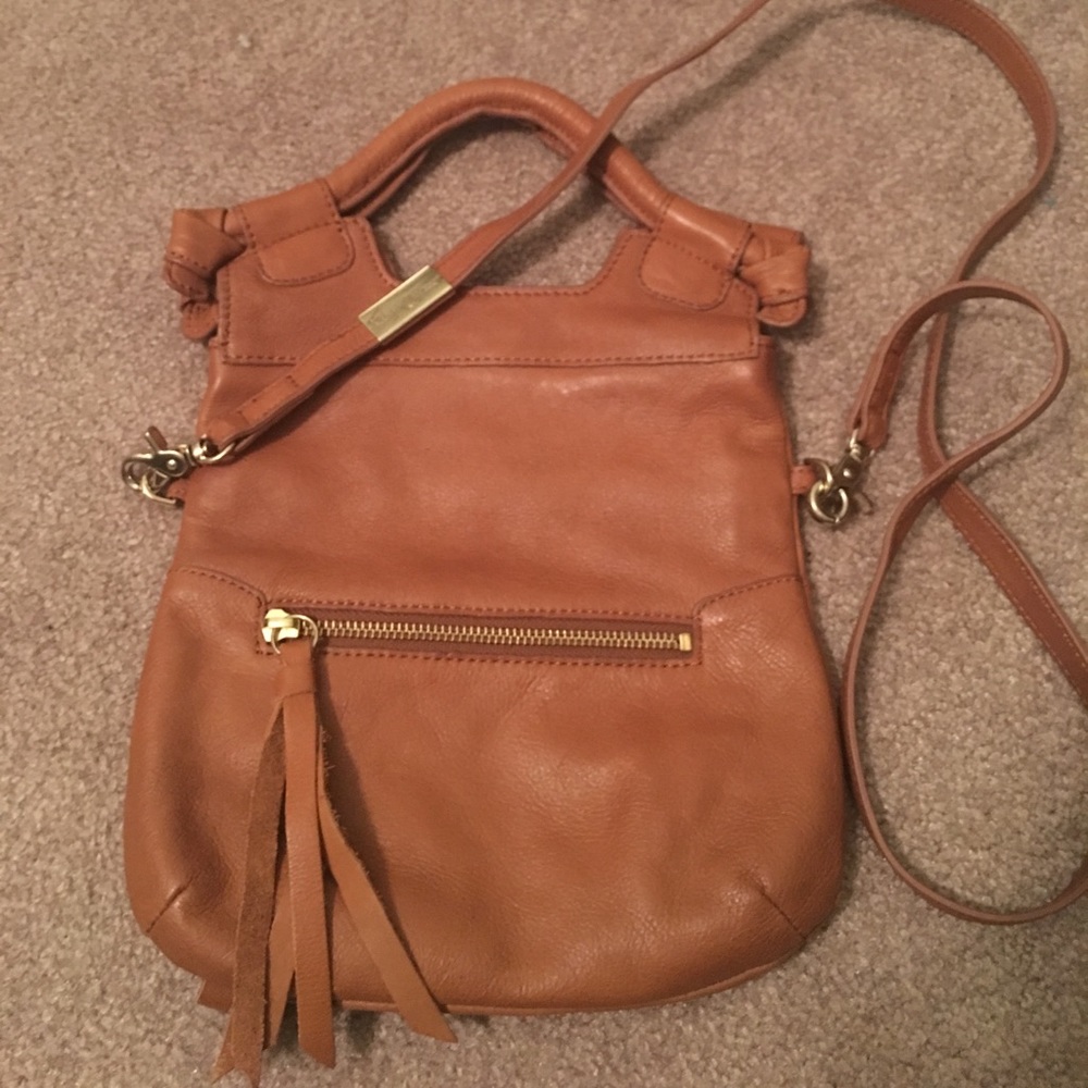 Brown leather fold over Foley and Corinna purse
