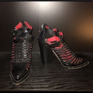 Black strappy, closed toe Jeffrey Cambell boots