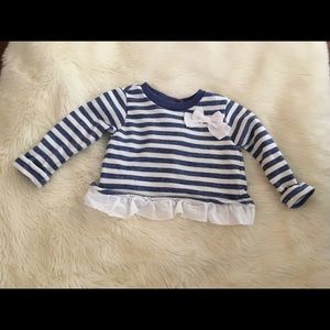 Stripped Sweater with ruffles and split back