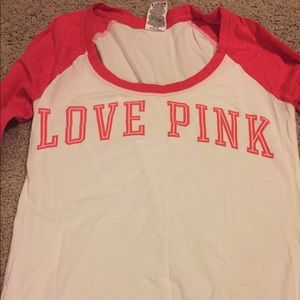 Pink long sleeve tee.