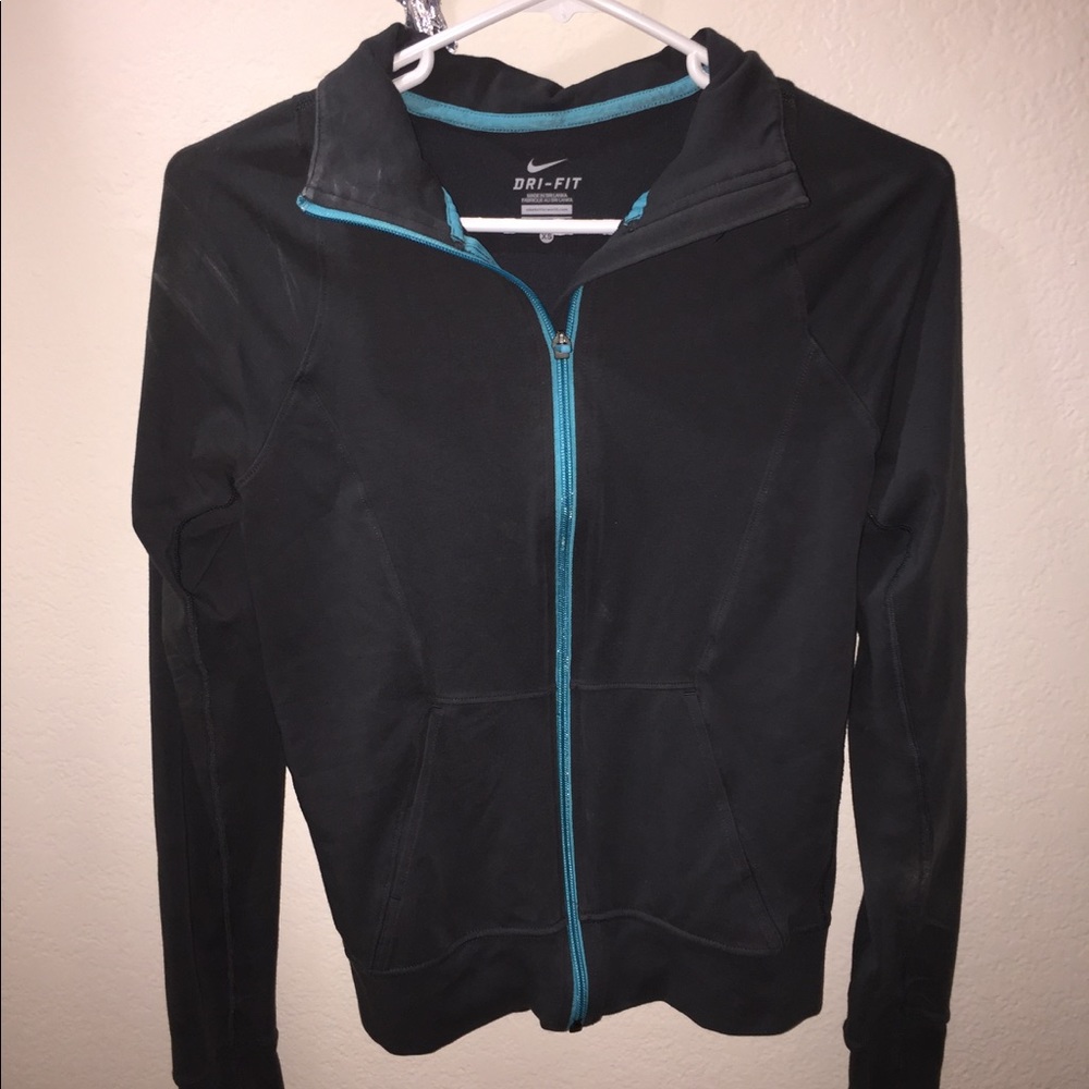 Grey and Teal Nike Dri-Fit running jacket.