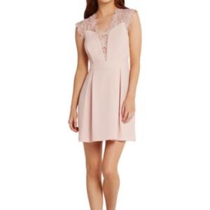 This is a short light pink BCBG dress.