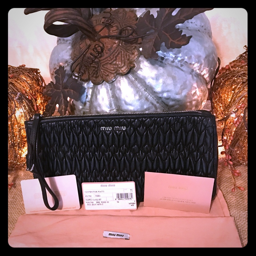 Miu Miu black leather zipper pouch.