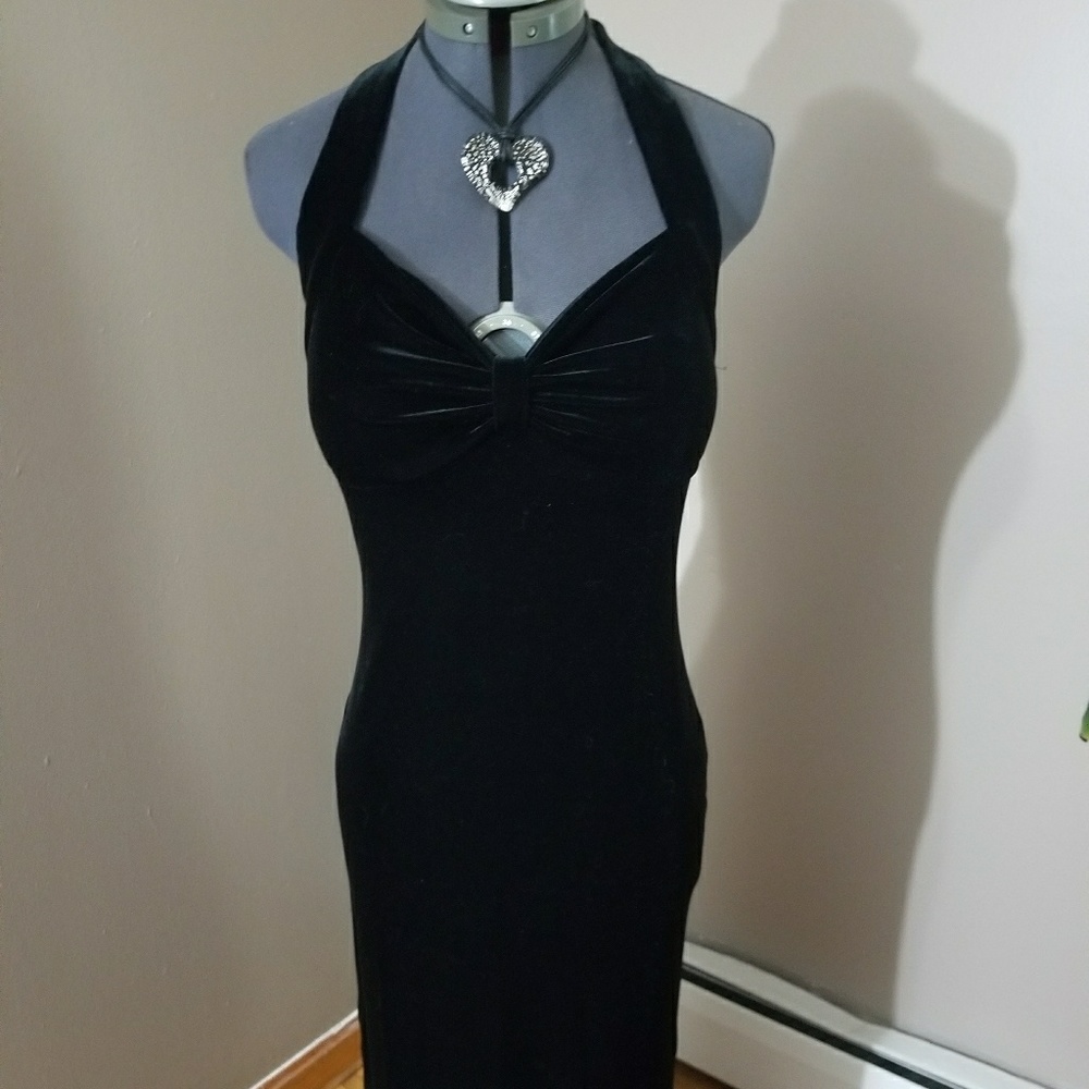 Form fitted black crushed velvet gown, side slits