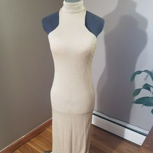 Shimmery gold form fitted gown with back slit