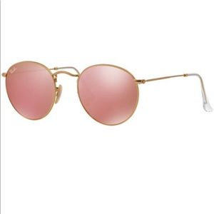 Pink round gold metal frame Ray-Ban sunglasses.