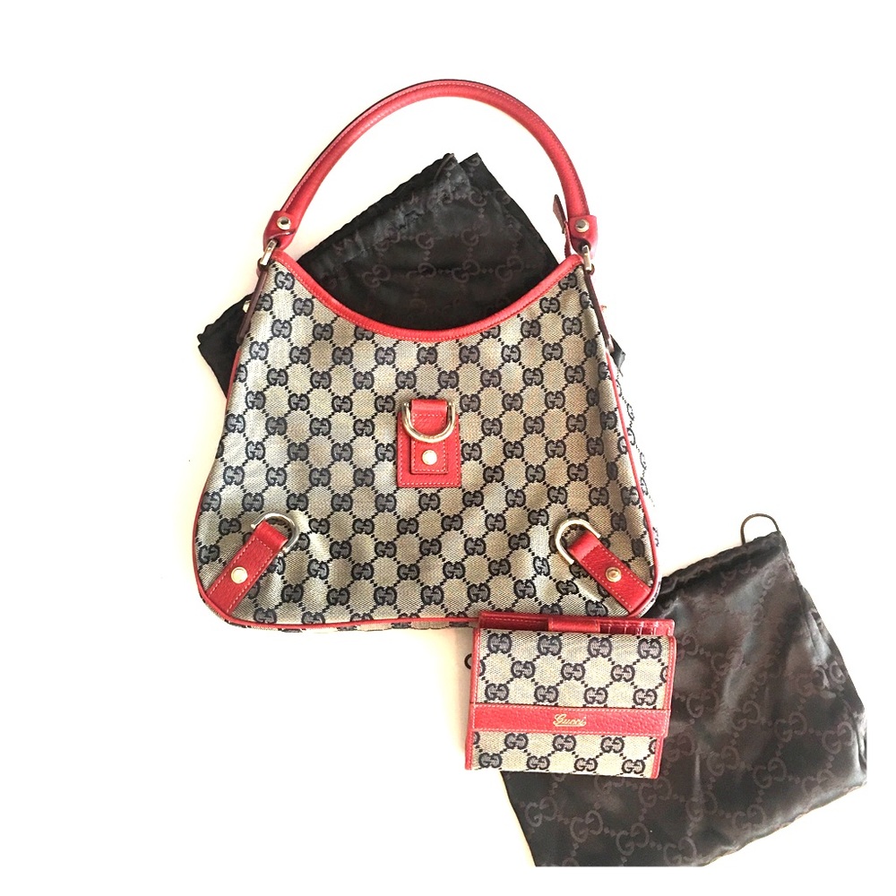 Red accented Gucci hobo with matching wallet.